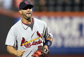 NEW YORK - JUNE 23:  Albert Pujols #5 of the St. Louis Cardinals celebrates after defeating the New York Mets at Citi Field on June 23, 2009 in the Flushing neighborhood of the Queens borough of New York City.  (Photo by Michael Heiman/Getty Images)