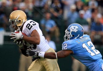 CHAPEL HILL, NC - OCTOBER 11:  Golden Tate #23 of the Notre Dame Fighting Irish catches a pass in front of Charles Brown #12 of the North Carolina Tar Heels during the first half of their game at Kenan Stadiium on October 11, 2008 in Chapel Hill, North Carolina. (Photo by Scott Halleran/Getty Images)