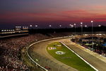 RICHMOND, VA - JUNE 27: The sun sets as drivers go into turn two during the IRL Indycar Series SunTrust Indy Challenge on June 27, 2009 at the Richmond International Speedway in Richmond, Virginia.  (Photo by Chris McGrath/Getty Images)
