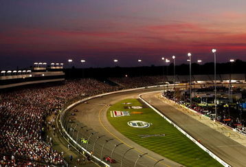 RICHMOND, VA - JUNE 27: The sun sets as drivers go into turn two during the IRL Indycar Series SunTrust Indy Challenge on June 27, 2009 at the Richmond International Speedway in Richmond, Virginia.  (Photo by Chris McGrath/Getty Images)