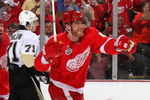 DETROIT - MAY 30:  Tomas Holmstrom #96 and Marian Hossa #81 of the Detroit Red Wings celebrate after Hossa's goal against the Pittsburgh Penguins during Game 1 of the 2009 Stanley Cup Finals at Joe Louis Arena on May 30, 2009 in Detroit, Michigan.  (Photo by Bruce Bennett/Getty Images)