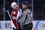 NEW YORK - FEBRUARY 28:  Ian Laperriere #14 of the Colorado Avalanche shouts at the New York Rangers bench as linesman Steve Barton #59 restrains him during the game on February 28, 2009 at Madison Square Garden in New York City.  (Photo by Chris McGrath/Getty Images)