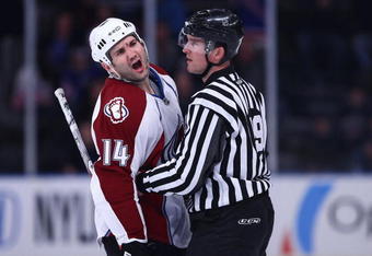 NEW YORK - FEBRUARY 28:  Ian Laperriere #14 of the Colorado Avalanche shouts at the New York Rangers bench as linesman Steve Barton #59 restrains him during the game on February 28, 2009 at Madison Square Garden in New York City.  (Photo by Chris McGrath/Getty Images)