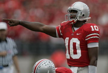 COLUMBUS, OH - SEPTEMBER 23:  Troy Smith #10 of the Ohio State Buckeyes calls a signal in behind center Vernon Gholston #50 during a game against the Penn State Nittany Lions during first quarter action on September 23, 2006 at Ohio Stadium in Columbus, Ohio. Ohio State won the game 28-6.  (Photo by Gregory Shamus/Getty Images)