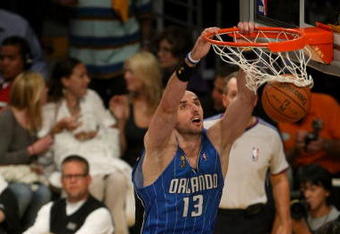 LOS ANGELES, CA - JUNE 04:  Marcin Gortat #13 of the Orlando Magic dunks the ball against the Los Angeles Lakers in the first half of Game One of the 2009 NBA Finals at Staples Center on June 4, 2009 in Los Angeles, California. NOTE TO USER: User expressly acknowledges and agrees that, by downloading and or using this photograph, User is consenting to the terms and conditions of the Getty Images License Agreement.  (Photo by Stephen Dunn/Getty Images)