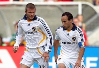 BRIDGEVIEW, IL - OCTOBER 21:  David Beckham #23 of the Los Angeles Galaxy looks on as teammate Landon Donovan #10 of the Los Angeles Galaxy moves the ball during their MLS match against the Chicago Fire on October 21, 2007 at Toyota Park in Bridgeview, Illinois.  The Fire defeated the Galaxy 1-0. (Photo by Jonathan Daniel/Getty Images)