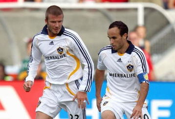 BRIDGEVIEW, IL - OCTOBER 21:  David Beckham #23 of the Los Angeles Galaxy looks on as teammate Landon Donovan #10 of the Los Angeles Galaxy moves the ball during their MLS match against the Chicago Fire on October 21, 2007 at Toyota Park in Bridgeview, Illinois.  The Fire defeated the Galaxy 1-0. (Photo by Jonathan Daniel/Getty Images)