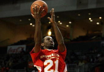 CORAL GABLES, FL - APRIL 01:  Michael Snaer #21 of the West Team drives against DeMarcus Cousins #15 of the East Team in the 2009 McDonald's All American Men's High School Basketball Game at BankUnited Center on April 1, 2009 in Coral Gables, Florida.  (Photo by Doug Benc/Getty Images)
