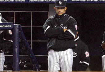 NEW YORK - MAY 04:  Manager Joe Girardi of the New York Yankees looks on against the Boston Red Sox on May 4, 2009 at Yankee Stadium in the Bronx borough of New York City. The Red Sox defeated the Yankees 6-4  (Photo by Jim McIsaac/Getty Images)