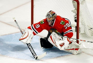 CHICAGO - MAY 22:  Goalie Nikolai Khabibulin #39 of the Chicago Blackhawks makes a save against the Detroit Red Wings during Game Three of the Western Conference Championship Round of the 2009 Stanley Cup Playoffs on May 22, 2009 at the United Center in Chicago, Illinois. The Blackhawks won 4-3 in overtime.  (Photo by Jim Prisching/Getty Images)