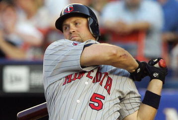 NEW YORK - JUNE 18: Michael Cuddyer #5 of the Minnesota Twins bats against the New York Mets during their interleague game at Shea Stadium June 18, 2007 in the Flushing neighborhood of the Queens borough of New York City. (Photo by Jim McIsaac/Getty Images) 