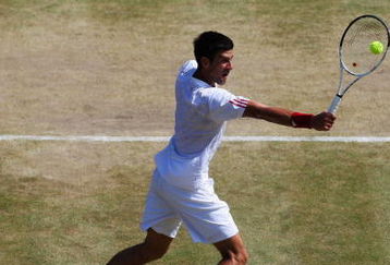 WIMBLEDON, ENGLAND - JULY 01:  Novak Djokovic of Serbia plays backhand during the men's singles quarter final match against Tommy Haas of Germany on Day Nine of the Wimbledon Lawn Tennis Championships at the All England Lawn Tennis and Croquet Club on July 1, 2009 in London, England.  (Photo by Hamish Blair/Getty Images)