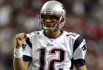 ATLANTA - OCTOBER 09:  Quarterback Tom Brady #12 of the New England Patriots pumps his fist after a touchdown during the first half of their game against the Atlanta Falcons on October 9, 2005 at the Georgia Dome in Atlanta, Georgia.  (Photo by Streeter Lecka/Getty Images)