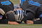 Carolina Panthers trainers examine running back Nick Goings during an injury timeout at  an NFC wildcard game January 8, 2006 at the Meadowlands.  The Carolina Panthers defeated the Giants 23 - 0.  (Photo by Al Messerschmidt/Getty Images)