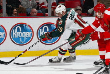 DETROIT - DECEMBER 7:  Marion Gaborik #10 of the Minnesota Wild tries to circle the net with the puck in a game against the Detroit Red Wings on December 7, 2007 at the Joe Louis Arena in Detroit, Michigan. (Photo by Claus Andersen/Getty Images)