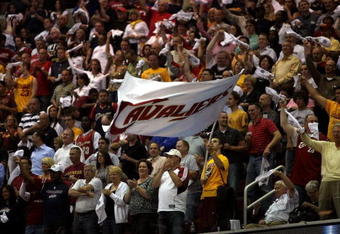 CLEVELAND - MAY 28: Fans wave a Cavaliers flag during Game Five of the Eastern Conference Finals between the Cleveland Cavaliers and the Orlando Magic  during the 2009 Playoffs at Quicken Loans Arena on May 28, 2009 in Cleveland, Ohio. NOTE TO USER: User expressly acknowledges and agrees that, by downloading and or using this photograph, User is consenting to the terms and conditions of the Getty Images License Agreement  (Photo by Elsa/Getty Images)