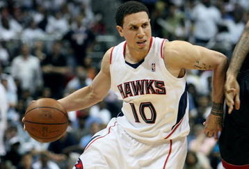 ATLANTA - APRIL 29:  Mike Bibby #10 of the Atlanta Hawks drives around James Jones #22 of the Miami Heat during Game Five of the Eastern Conference Quarterfinals at Philips Arena on April 29, 2009 in Atlanta, Georgia. The Hawks defeated the Heat 106-91. NOTE TO USER: User expressly acknowledges and agrees that, by downloading and/or using this Photograph, user is consenting to the terms and conditions of the Getty Images License Agreement.  (Photo by Doug Benc/Getty Images)