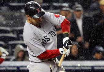 NEW YORK - MAY 05:  Mike Lowell #25 of the Boston Red Sox breaks his bat against the New York Yankees in the eigth innig on May 5, 2009 at Yankee Stadium in the Bronx borough of New York City.  (Photo by Jim McIsaac/Getty Images)