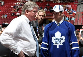 MONTREAL, QC - JUNE 27:  Kenny Ryan speaks to General Manager Brian Burke of the Toronto Maple Leafs organization after he was drafted by the Leafs in the second round during the 2009 NHL Entry Draft at the Bell Centre on June 27, 2009 in Montreal, Quebec, Canada. (Photo by Bruce Bennett/Getty Images) 