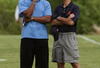 LAKE FOREST, IL - MAY 31: General manager Jerry Angelo of the Chicago Bears (R) talks with former Bear Otis Wilson during a mini-camp practice on May 31, 2008 at Halas Hall in Lake Forest, Illinois. (Photo by Jonathan Daniel/Getty Images)