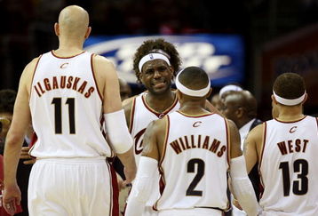 CLEVELAND - MAY 20:  LeBron James #23 reacts after a play with teammates Zydrunas Ilgauskas #11, Mo Williams #2 and Delonte West #13 of the Cleveland Cavaliers against the Orlando Magic in Game One of the Eastern Conference Finals during the 2009 Playoffs at Quicken Loans Arena on May 20, 2009 in Cleveland, Ohio. NOTE TO USER: User expressly acknowledges and agrees that, by downloading and or using this photograph, User is consenting to the terms and conditions of the Getty Images License Agreement  (Photo by Elsa/Getty Images)