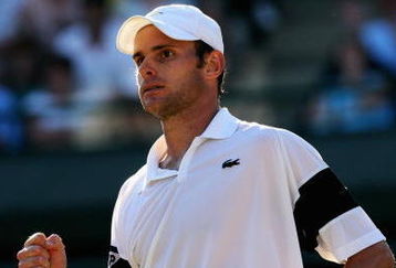 WIMBLEDON, ENGLAND - JULY 01:  Andy Roddick of USA celebrates during the men's singles quarter final match against Lleyton Hewitt of Australia on Day Nine of the Wimbledon Lawn Tennis Championships at the All England Lawn Tennis and Croquet Club on July 1, 2009 in London, England.  (Photo by Hamish Blair/Getty Images)