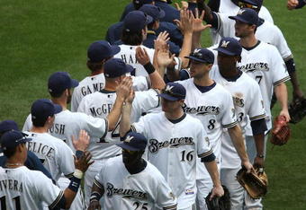MILWAUKEE - MAY 14: Members of the Milwaukee Brewers including Mike Cameron #25, Chris Duffy #16, Ryan Braun #8 and Rickie Weeks #23 celebrate a win over the Florida Marlins on May 14, 2009 at Miller Park in Milwaukee, Wisconsin. The Brewers defeated the Marlins 5-3. (Photo by Jonathan Daniel/Getty Images)
