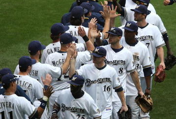 MILWAUKEE - MAY 14: Members of the Milwaukee Brewers including Mike Cameron #25, Chris Duffy #16, Ryan Braun #8 and Rickie Weeks #23 celebrate a win over the Florida Marlins on May 14, 2009 at Miller Park in Milwaukee, Wisconsin. The Brewers defeated the Marlins 5-3. (Photo by Jonathan Daniel/Getty Images)