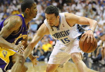 ORLANDO, FL - JUNE 14:  Hedo Turkoglu #15 of the Orlando Magic moves the ball against Trevor Ariza #3 of the Los Angeles Lakers in Game Five of the 2009 NBA Finals on June 14, 2009 at Amway Arena in Orlando, Florida. The Lakers won 99-86.  NOTE TO USER:  User expressly acknowledges and agrees that, by downloading and or using this photograph, User is consenting to the terms and conditions of the Getty Images License Agreement. (Photo by Ronald Martinez/Getty Images) 