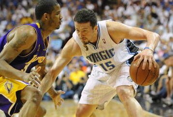 ORLANDO, FL - JUNE 14:  Hedo Turkoglu #15 of the Orlando Magic moves the ball against Trevor Ariza #3 of the Los Angeles Lakers in Game Five of the 2009 NBA Finals on June 14, 2009 at Amway Arena in Orlando, Florida. The Lakers won 99-86.  NOTE TO USER:  User expressly acknowledges and agrees that, by downloading and or using this photograph, User is consenting to the terms and conditions of the Getty Images License Agreement. (Photo by Ronald Martinez/Getty Images) 