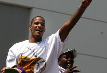 LOS ANGELES, CA - JUNE 17:  Trevor Ariza #3  waves to the crowd from the top of a double decker bus at the start of Los Angeles Lakers NBA championship victory parade outside the Staples Center on June 17, 2009 in Los Angeles, California.  (Photo by Stephen Dunn/Getty Images)