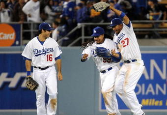 LOS ANGELES, CA - APRIL 30:  Matt Kemp #27 of the Los Angeles Dodgers celebrates a 8-5 win with Manny Ramirez #99 and Andre Ethier #16 over the San Diego Padres after the ninth inning at Dodger Stadium on April 30, 2009 in Los Angeles, California.  The Dodgers would win 8-5.  (Photo by Harry How/Getty Images)