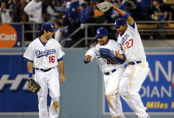 LOS ANGELES, CA - APRIL 30:  Matt Kemp #27 of the Los Angeles Dodgers celebrates a 8-5 win with Manny Ramirez #99 and Andre Ethier #16 over the San Diego Padres after the ninth inning at Dodger Stadium on April 30, 2009 in Los Angeles, California.  The Dodgers would win 8-5.  (Photo by Harry How/Getty Images)