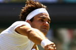 WIMBLEDON, ENGLAND - JULY 01:  Roger Federer of Switzerland serves during the men's singles quarter final match against Ivo Karlovic of Croatia on Day Nine of the Wimbledon Lawn Tennis Championships at the All England Lawn Tennis and Croquet Club on July 1, 2009 in London, England.  (Photo by Paul Gilham/Getty Images)