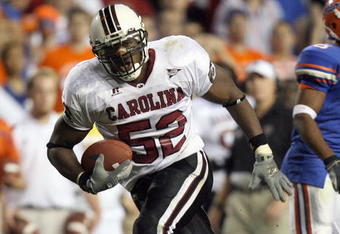 GAINESVILLE, FL - NOVEMBER 11:  Jasper Brinkley #52 of the South Carolina Gamecocks carries the ball during the game against the University of Florida Gators at Ben Hill Griffin Stadium November 11, 2006 in Gainesville, Florida. (Photo by Doug Benc/Getty Images)