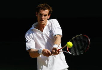 WIMBLEDON, ENGLAND - JULY 01:  Andy Murray of Great Britain plays a backhand during the men's singles quarter final match against Juan Carlos Ferrero of Spain on Day Nine of the Wimbledon Lawn Tennis Championships at the All England Lawn Tennis and Croquet Club on July 1, 2009 in London, England.  (Photo by Paul Gilham/Getty Images)