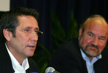 HOMESTEAD, FL - FEBRUARY 27:  Tony George (L), president and CEO of the IndyCar Series and Kevin Kalkhoven, co-owner of the Champ Car World Series speaks at a press conference announcing the merger of the IndyCar Series and the Champ Car World Series after a 12 year split, prior to the IndyCar Series spring testing on February 27, 2008 at the Homestead-Miami Speedway in Homestead, Florida.  (Photo by Robert Laberge/Getty Images)