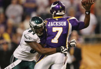 MINNEAPOLIS - JANUARY 04:   Tavaris Jackson #7 of the Minnesota Vikings is hit by Chris Clemons #91 of the Philadelphia Eagles during the NFC Wild Card playoff game on January 4, 2009 at the Hubert H. Humphrey Metrodome in Minneapolis, Minnesota. The Eagles defeated the Vikings 26-14.(Photo by Elsa/Getty Images)
