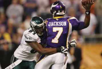 MINNEAPOLIS - JANUARY 04:   Tavaris Jackson #7 of the Minnesota Vikings is hit by Chris Clemons #91 of the Philadelphia Eagles during the NFC Wild Card playoff game on January 4, 2009 at the Hubert H. Humphrey Metrodome in Minneapolis, Minnesota. The Eagles defeated the Vikings 26-14.(Photo by Elsa/Getty Images)