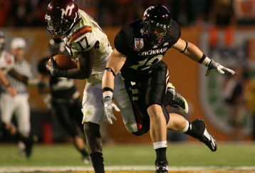 MIAMI - JANUARY 01:  Kam Chancellar #17 intercepts the ball against Ben Guidugli #19 of the Virginia Tech Hokies of the Virginia Tech Hokies Cincinnati Bearcats during the FedEx Orange Bowl at Dolphin Stadium on January 1, 2009 in Miami, Florida.  (Photo by Marc Serota/Getty Images)
