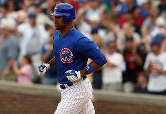 CHICAGO - JUNE 18:  Derrek Lee #25 of the Chicago Cubs rounds the bases after hitting a home run against the Chicago White Sox during the game on June 18, 2009 at Wrigley Field in Chicago, Illinois. (Photo by Jonathan Daniel/Getty Images)