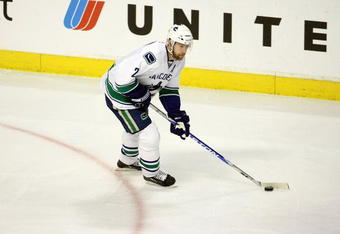 CHICAGO - MAY 05:  Mattias Ohlund #2 of the Vancouver Canucks skates with the puck against the Chicago Blackhawks during Game Three of the Western Conference Semifinal Round of the 2009 Stanley Cup Playoffs on May 5, 2009 at the United Center in Chicago, Illinois  (Photo by Jonathan Daniel/Getty Images)