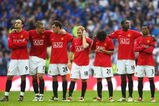 LONDON, ENGLAND - APRIL 19:  Manchester United players look despondent in the penalty shoot out during the FA Cup sponsored by E.ON Semi Final match between Everton and Manchester United at Wembley Stadium on April 19, 2009 in London, England.  (Photo by Jamie McDonald/Getty Images)