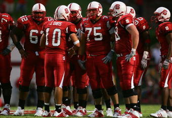 RALEIGH, NC - SEPTEMBER 4:  Quarterback Jay Davis #10 of the North Carolina State University Wolfpack talks to his teammates during the game against the Virginia Polytechnic Institute and State University Hokies at Carter-Finley Stadium on September 4, 2005 in Raleigh, North Carolina.  Virginia Tech won 20-16.  (Photo by Streeter Lecka/Getty Images)