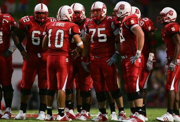 RALEIGH, NC - SEPTEMBER 4:  Quarterback Jay Davis #10 of the North Carolina State University Wolfpack talks to his teammates during the game against the Virginia Polytechnic Institute and State University Hokies at Carter-Finley Stadium on September 4, 2005 in Raleigh, North Carolina.  Virginia Tech won 20-16.  (Photo by Streeter Lecka/Getty Images)