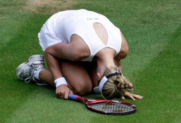 WIMBLEDON, ENGLAND - JULY 02:  Elena Dementieva of Russia looks dejected during the women's singles semi final match against Serena Williams of USA on Day Ten of the Wimbledon Lawn Tennis Championships at the All England Lawn Tennis and Croquet Club on July 2, 2009 in London, England.  (Photo by Stefan Wermuth/Pool/Getty Images)