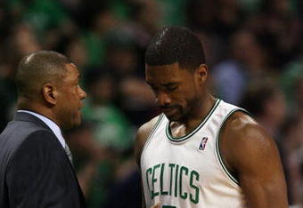 BOSTON - APRIL 18:  Head coach Doc Rivers of the Boston Celtics consoles Leon Powe #0 in the second half against the Chicago Bulls in Game One of the Eastern Conference Quarterfinals during the 2009 NBA Playoffs at TD Banknorth Garden on April 18, 2009 in Boston, Massachusetts. The Chicago Bulls defeated the Boston Celtics 105-103 in overtime. NOTE TO USER: User expressly acknowledges and agrees that, by downloading and or using this photograph, User is consenting to the terms and conditions of the Getty Images License Agreement. (Photo by Elsa/Getty Images)