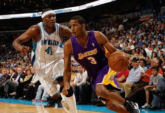 NEW ORLEANS - NOVEMBER 12:  Trevor Ariza #3 of the Los Angeles Lakers moves the ball against James Posey #41 of the New Orleans Hornets at the New Orleans Arena on November 12, 2008 in New Orleans, Louisiana. The Lakers won 93-86. NOTE TO USER: User expressly acknowledges and agrees that, by downloading and/or using this Photograph, user is consenting to the terms and conditions of the Getty Images License Agreement.  (Photo by Chris Graythen/Getty Images)
