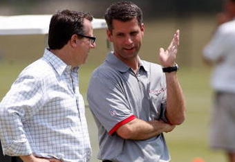 TAMPA - MAY 01:  General Manager Mark Dominik of the Tampa Bay Buccaneers talks with team owner Bryan Glazer during the Buccaneers Rookie Minicamp at One Buccaneer Place on May 1, 2009 in Tampa, Florida.  (Photo by J. Meric/Getty Images)
