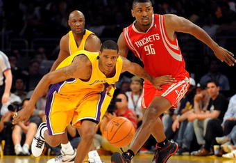 LOS ANGELES, CA - MAY 06:  Trevor Ariza #3 of the Los Angeles Lakers and Ron Artest #96 of the Houston Rockets look at the ball in the second quarter of Game Two of the Western Conference Semifinals during the 2009 NBA Playoffs at Staples Center on May 6, 2009 in Los Angeles, California. NOTE TO USER: User expressly acknowledges and agrees that, by downloading and or using this photograph, User is consenting to the terms and conditions of the Getty Images License Agreement.  (Photo by Harry How/Getty Images)